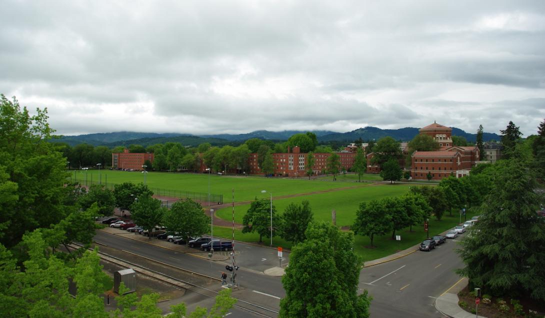 Aerial photo of OSU campus, green grassy field with brick buildings