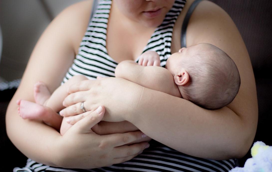 Mother holding newborn baby