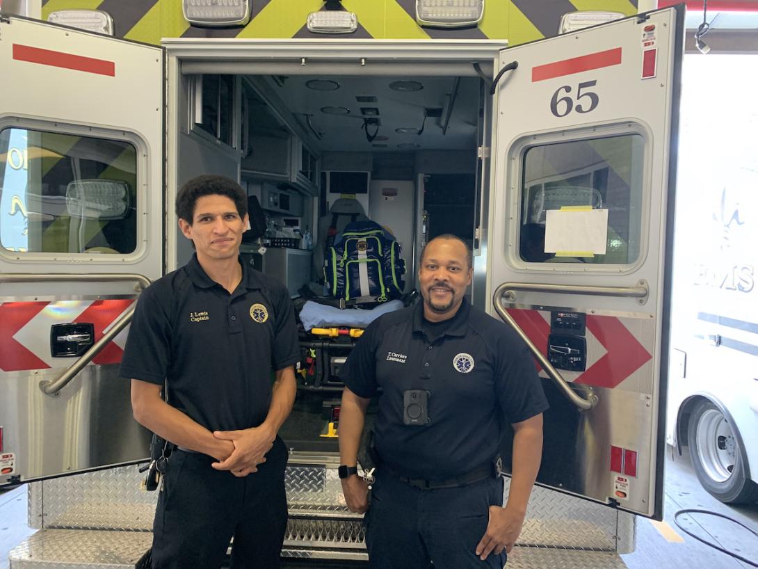 New Orleans ambulance officials face increasing heat Two paramedics in uniform stand in front of an ambulance.