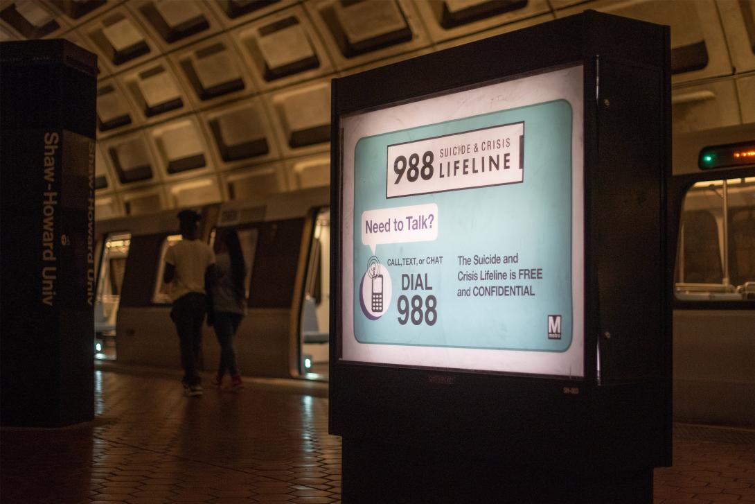 An advertisement for the Suicide and Crisis Lifeline’s 988 hotline at the Shaw-Howard University subway station in Washington, D.C An advertisement for the Suicide and Crisis Lifeline’s 988 hotline at the Shaw-Howard University subway station in Washington, D.C