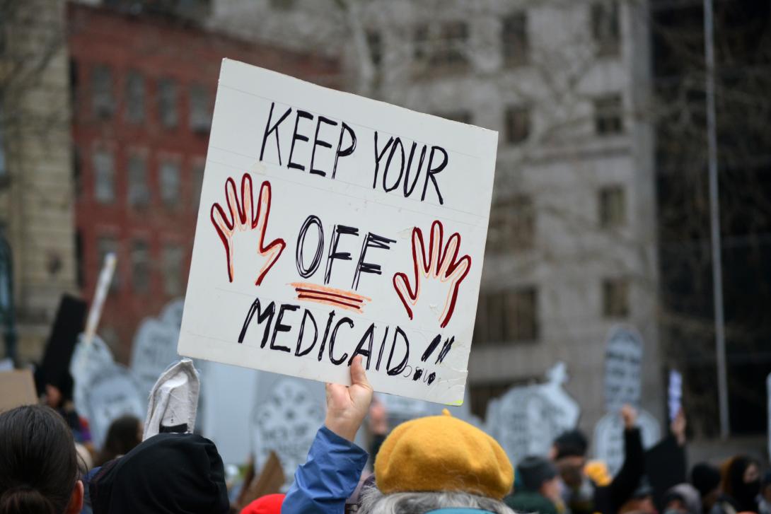 Sign, crowd protest Medicaid cuts Sign, crowd protest Medicaid cuts
