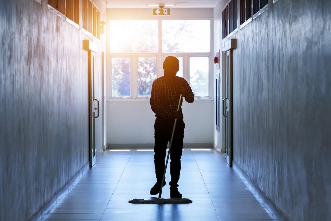 man sweeping hallway man sweeping hallway