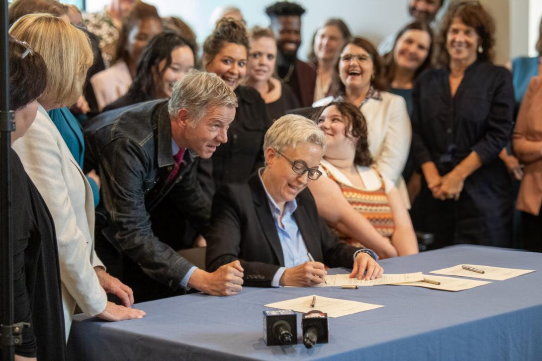 Tina Kotek signs a behavioral health bill in Salem.