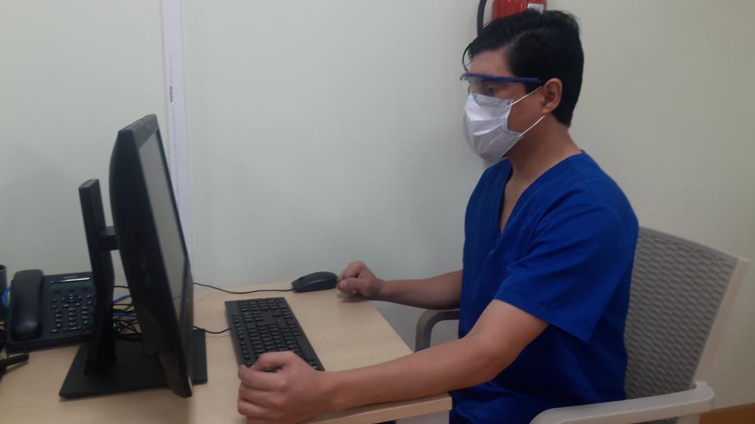 Telehealth. A doctor consults with a patient via laptop.