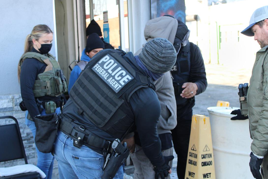 ICE agents detain a man at a car wash in Philadelphia in January 2025.