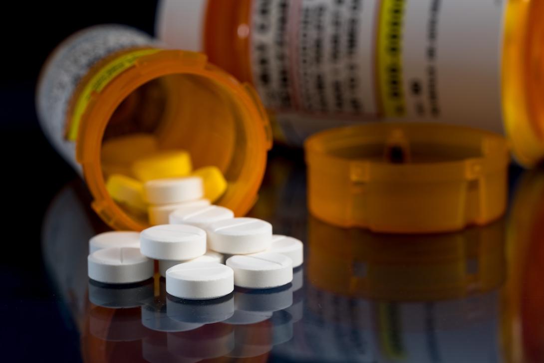 Pills spilling out of a bottle