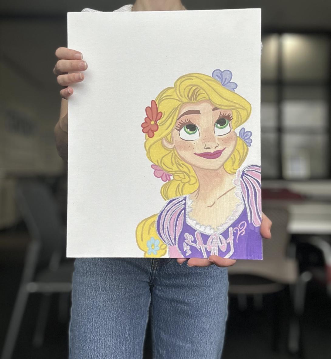 An attorney holds up a drawing of Rapunzel by Carlos' daughter, who has been in a federal shelter with her brother for nearly a year since the pair crossed the border to be with their father.
