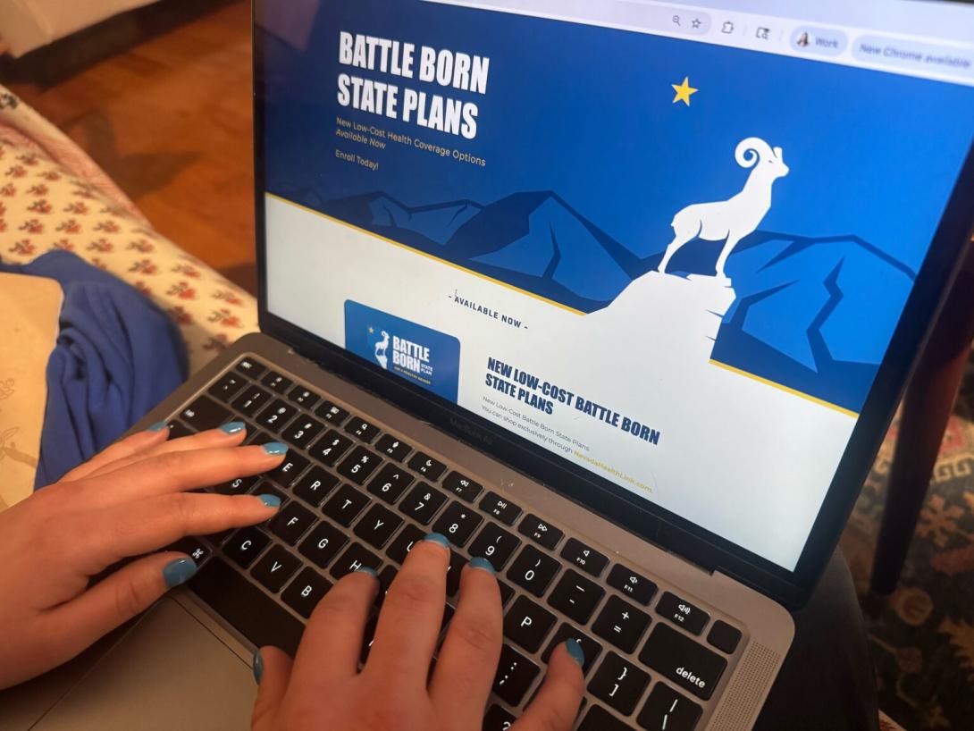 A woman examines Nevada's health care options online. 