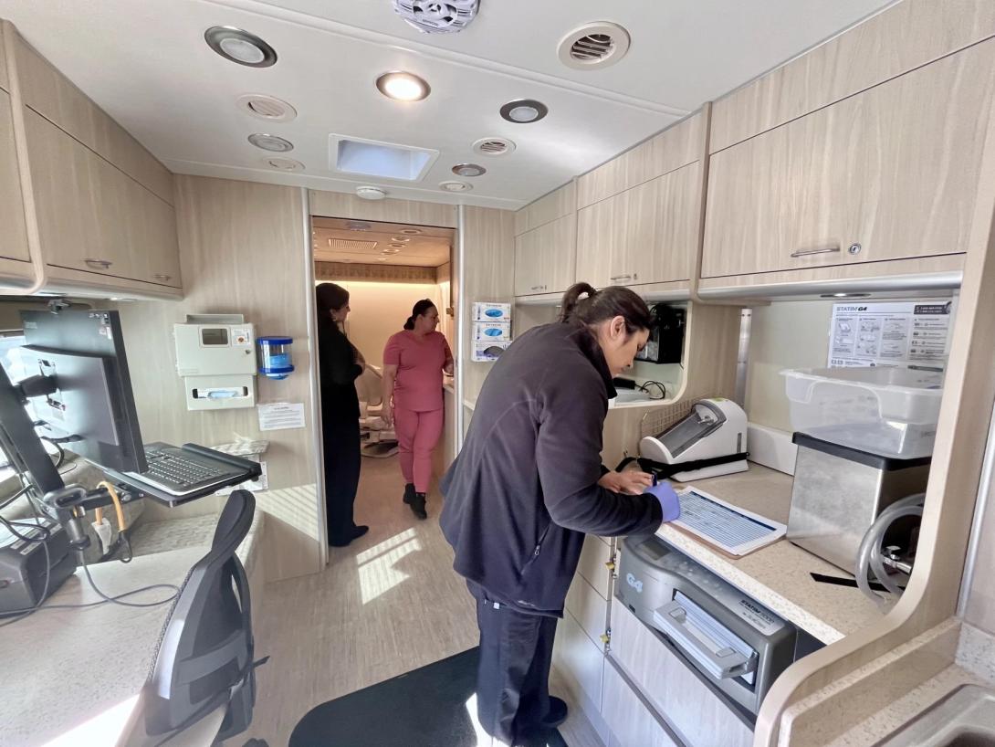 Medical assistant Elda Medina takes notes in the new mobile health center.