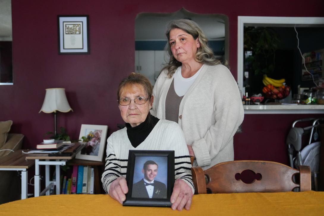 Mary Jannotta, left, and Susan Ousterman with a picture of Ousterman's son, Tyler Cordeiro, who died of a drug overdose in 2020.