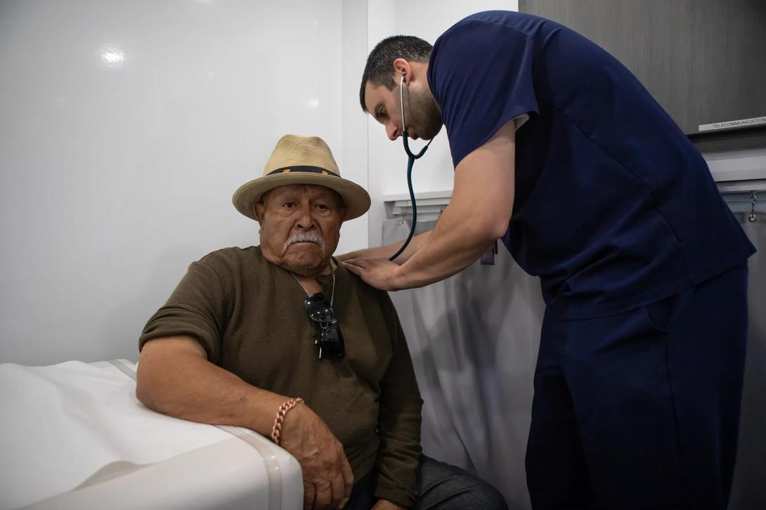 A man gets a checkup in a mobile clinic in Parlier, Calif., in May 2025.