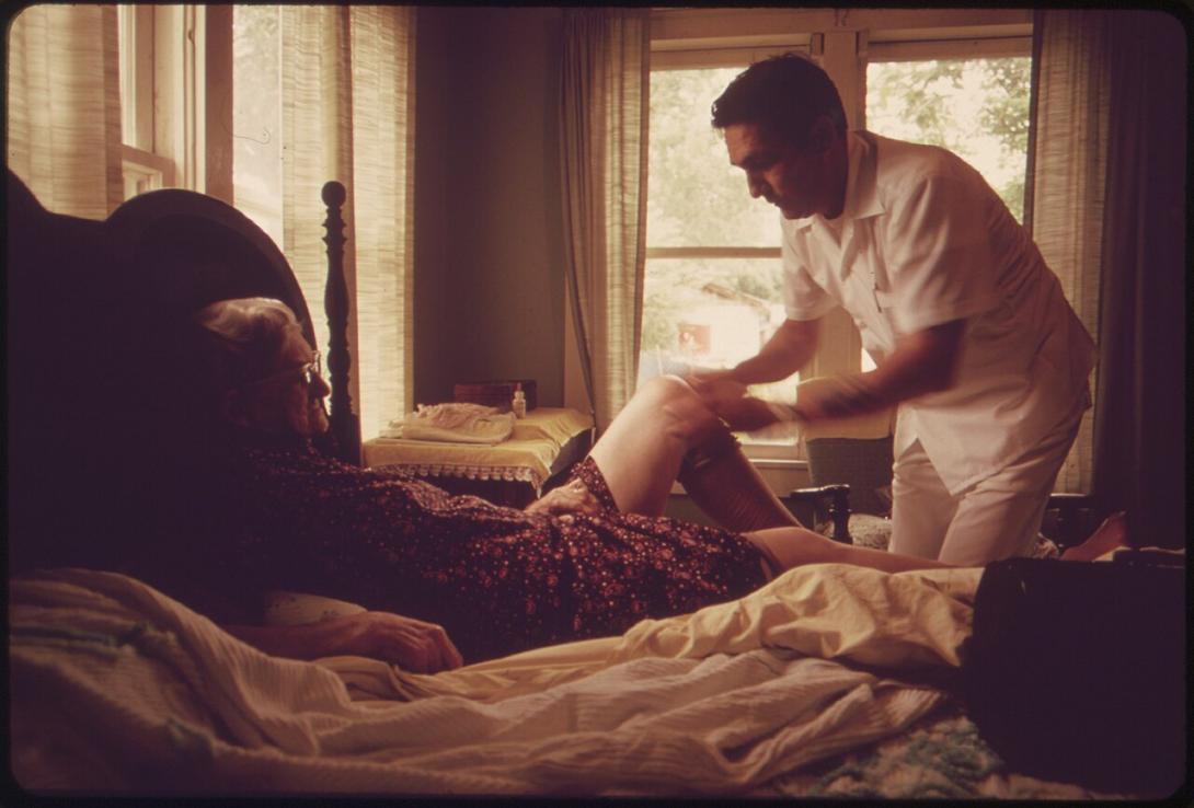 A doctor visits an elderly patient.