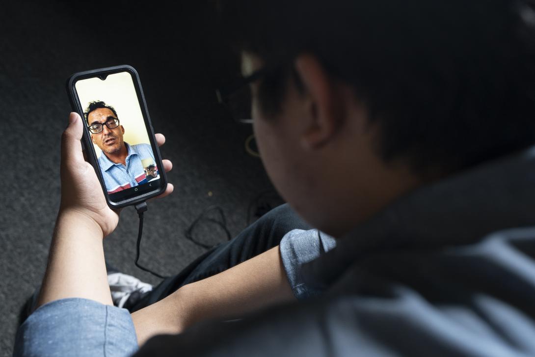 Damian Zermeño talks to his father, who was arrested and deported to Mexico, over video chat. 