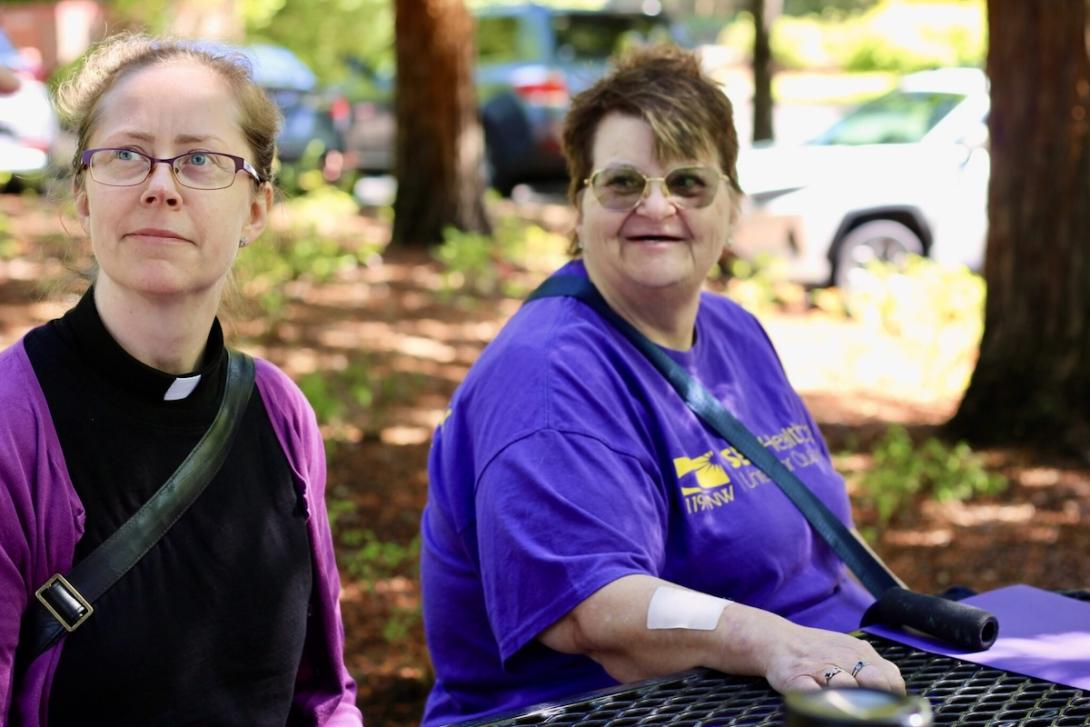 April Frazier, left, and Milli Palmer sit together.