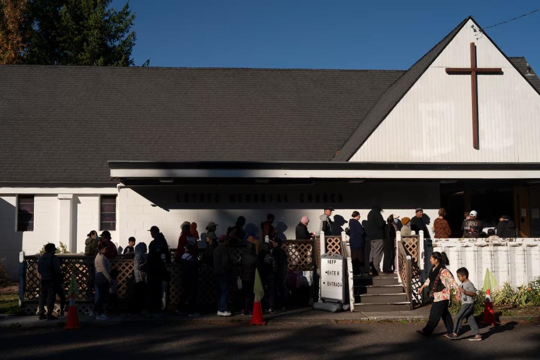 People line up early to get food from the Ecumenical Ministries of Oregon’s Northeast Emergency Food Program food bank.