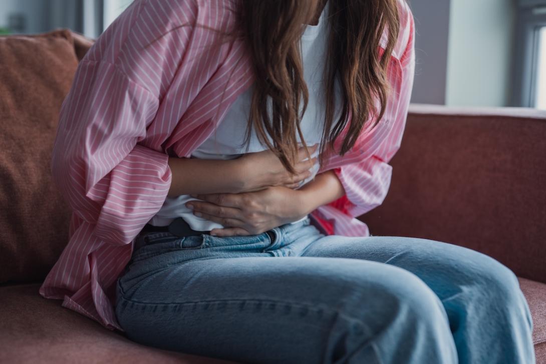 Hands on stomach, illness